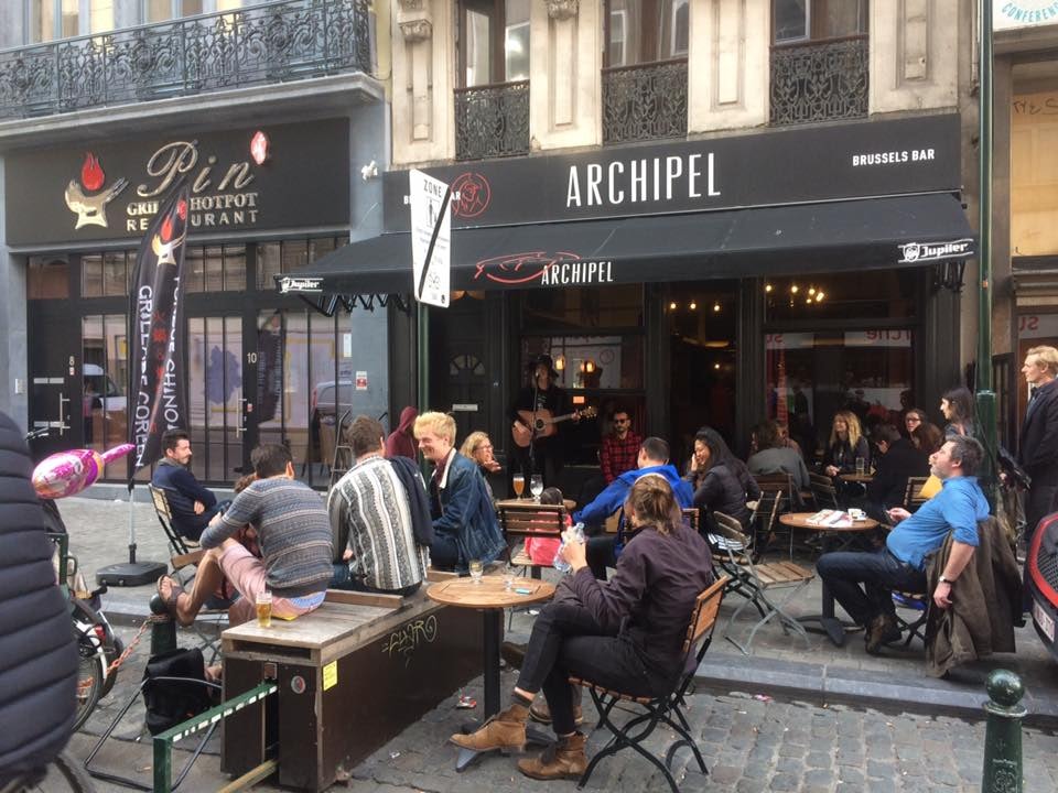 people enjoying a drink outside Archipel bar in Brussels