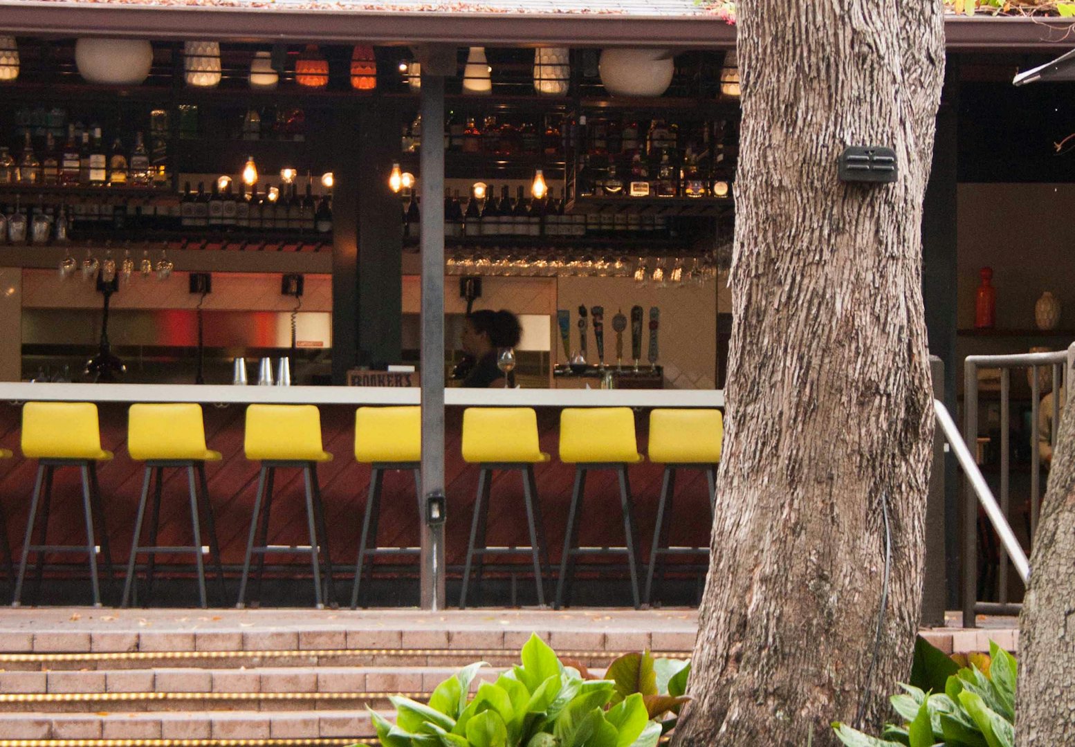 bar stools and interior of Glass and Vine bar in Miami